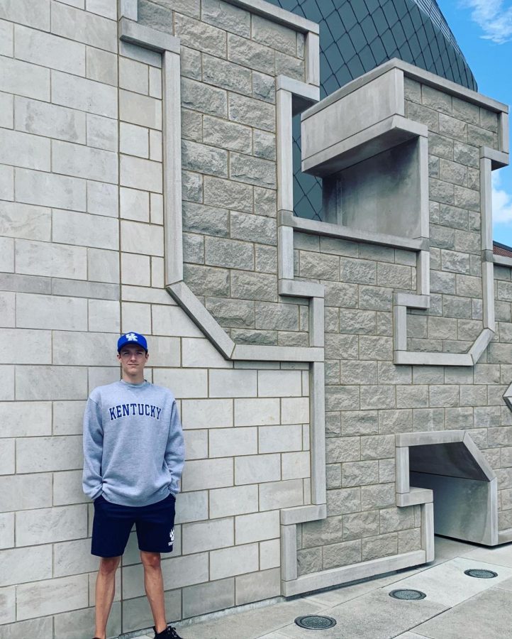 While touring the campus, Hamilton takes a picture outside of the swimming facility.