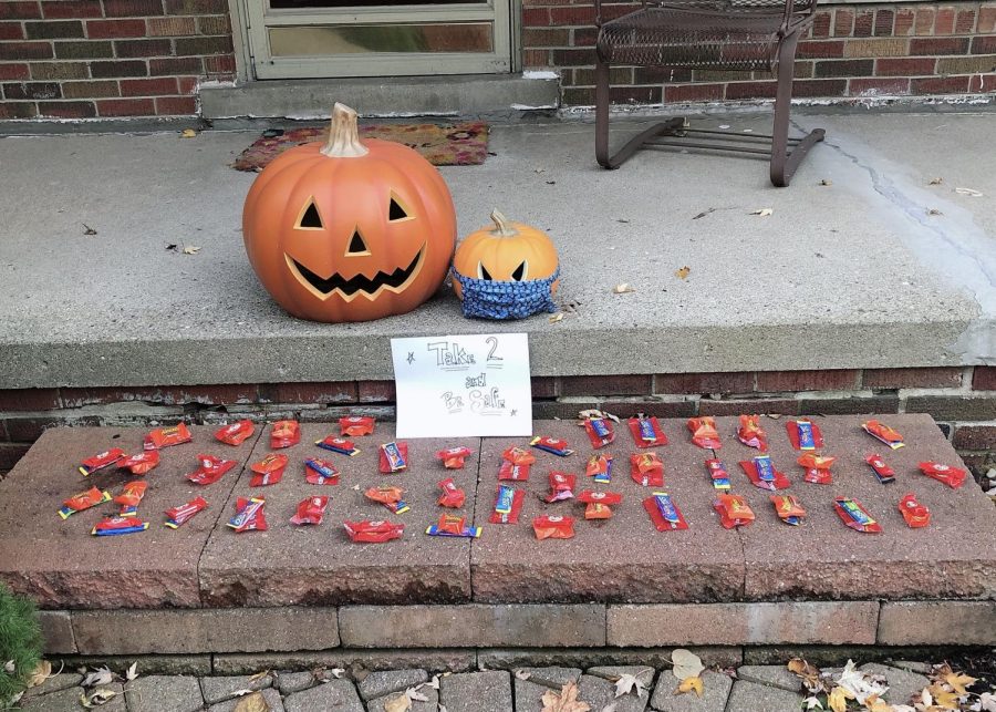 Candy is set out on the porch for kids to take