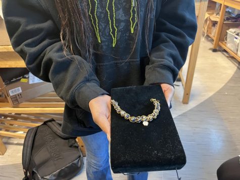 Sophomore Jeda Kyles displaying the finished necklace she made