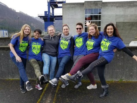 Ms. Rubestein (center) with her BHS students on a STEM PNW trip, in front of a hydroelectric dam and fish ladder.