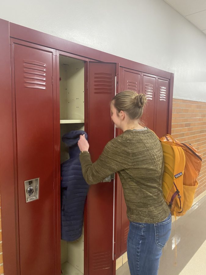 Junior Lily Tuite using her locker