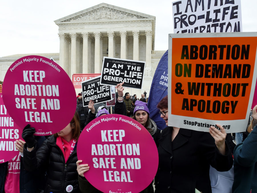 Pro-choice and pro-life activists demonstrate in front of the the US Supreme Court during the 47th annual March for Life on January 24, 2020 in Washington, DC. - Activists gathered in the nations capital for the annual event to mark the anniversary of the Supreme Court Roe v. Wade ruling that legalized abortion in 1973. (Photo by OLIVIER DOULIERY / AFP) (Photo by OLIVIER DOULIERY/AFP via Getty Images)