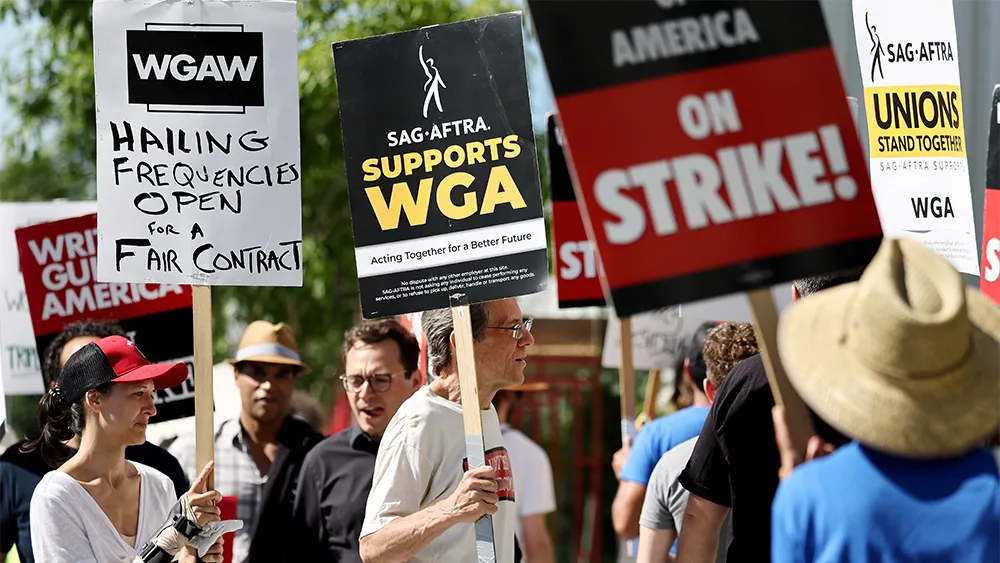 Members of the Writers Guild of America parade the streets of Hollywood in support of the writers strike.