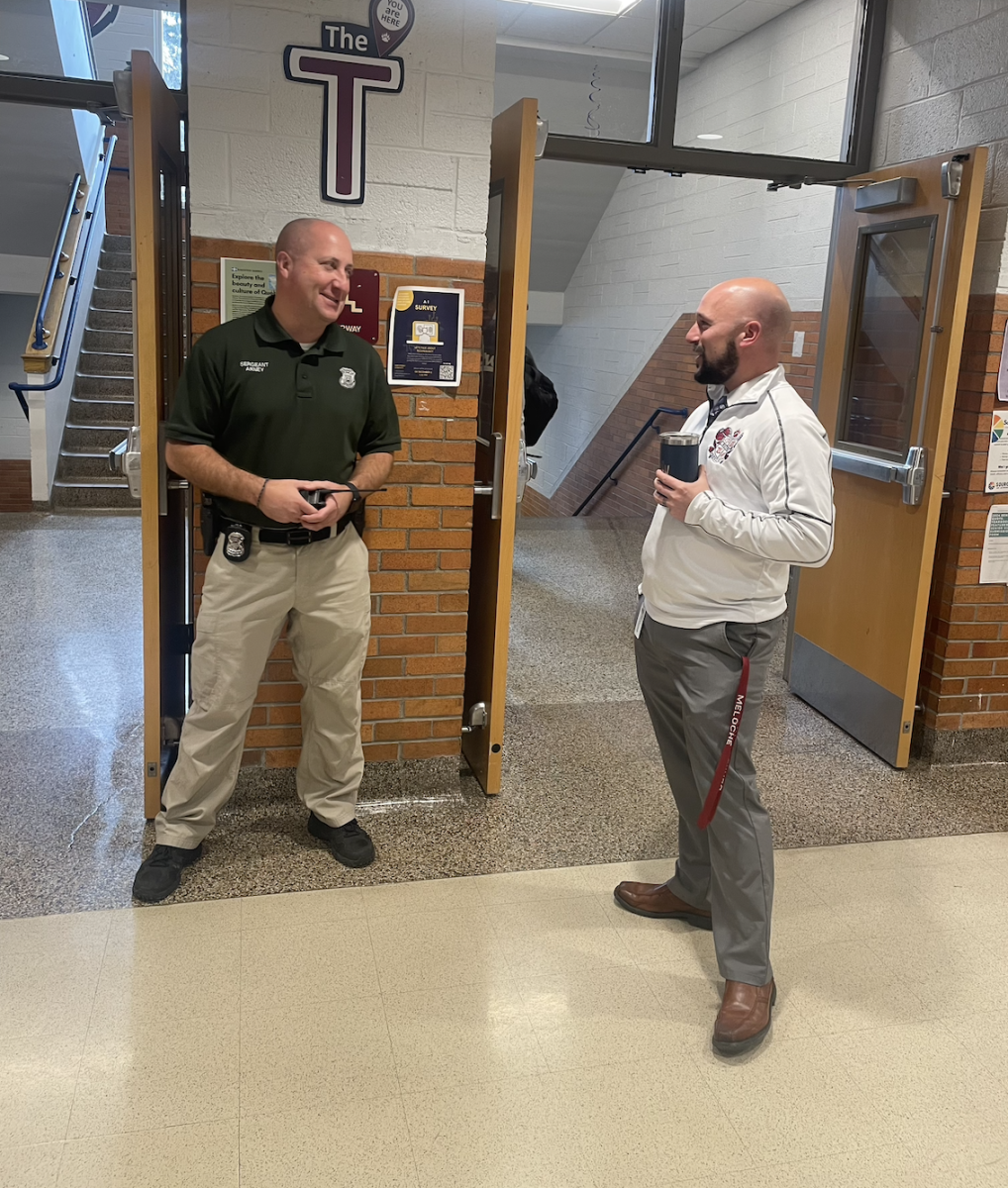 Mr. Meloche and Sgt. Arney at the T during passing time.