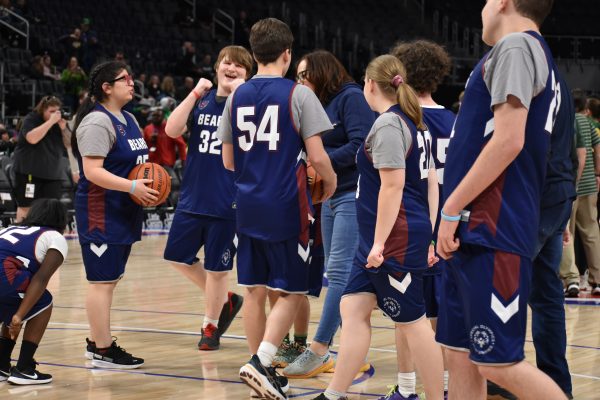 Members of the Unified Basketball team prep for their game at Little Caesars Arena on March 17th