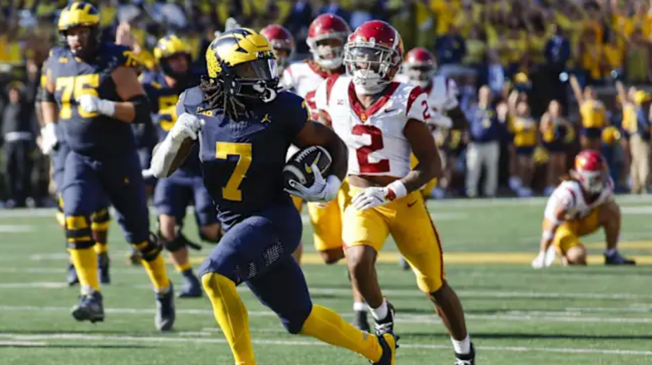 Michigan running back Donovan Edwards, runs past the USC defense.