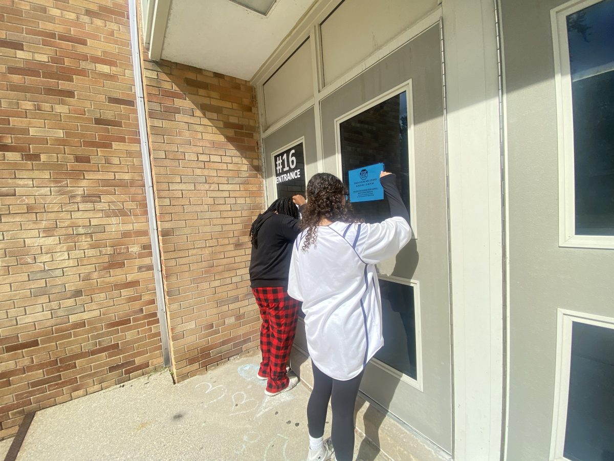 Students trying enter into the school via the senior doors.