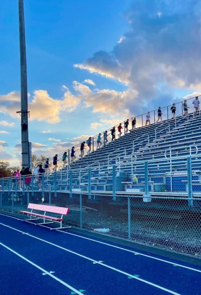 Girls basketball team running bleachers during conditioning