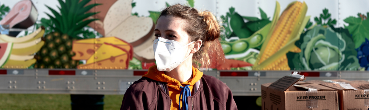 Volunteer working at forgotten harvest during covid