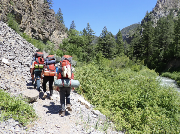 Laila Goodstein, Cooper Aronoff, and Lev Babcock hiking on the Western trip. Photo by Reid Markle.