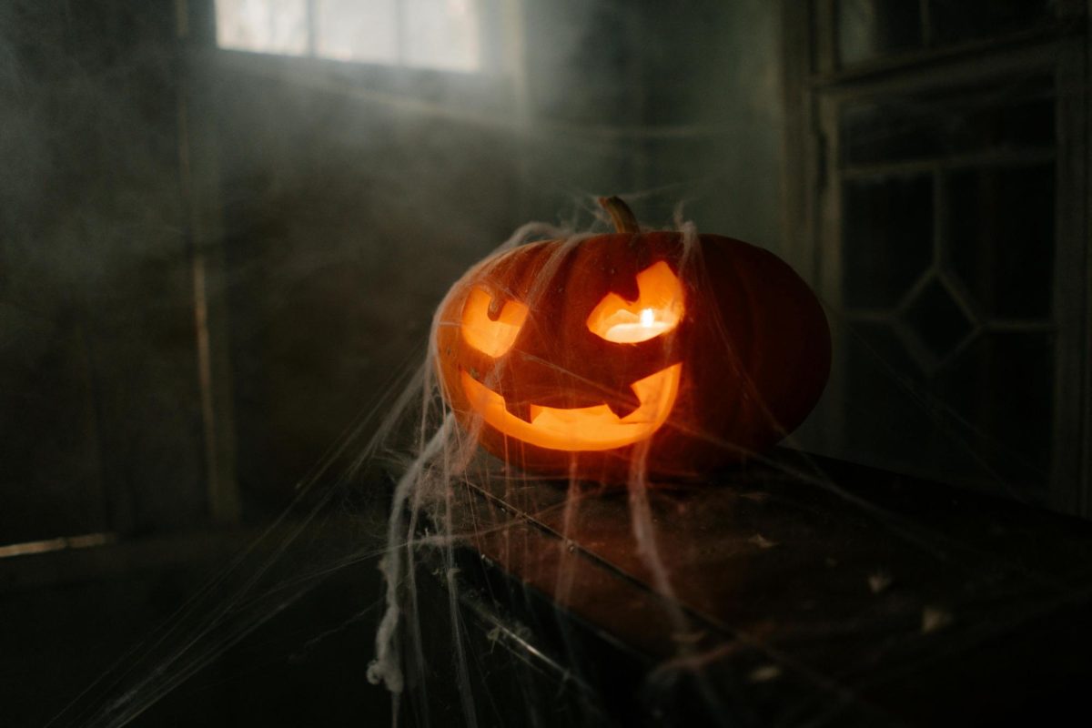 Halloween Jack-O-Lantern covered in spiderwebs. Credit: Pexels/Cottonbro