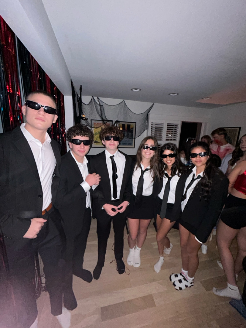 Last year, freshman students gathered at a Halloween party dressed as Men in Black (Photo by Liv Khoury)
