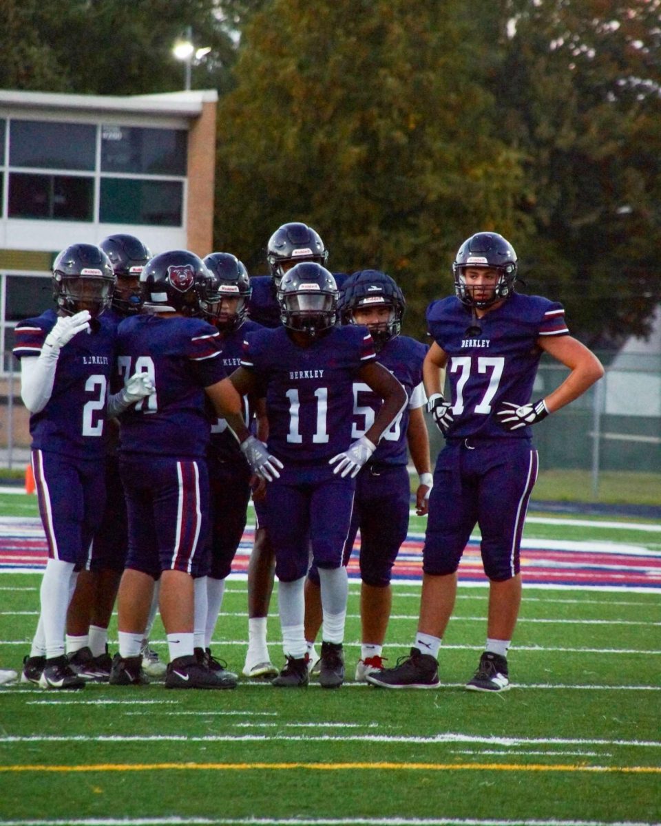 The Berkley offense in the huddle getting ready to run a play. Photo Courtesy of Matthew Schneider