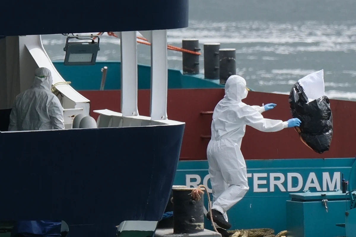Worker's evacuating and cleaning the MV Hondius
Photo Courtesy of Patrick Post at AP News